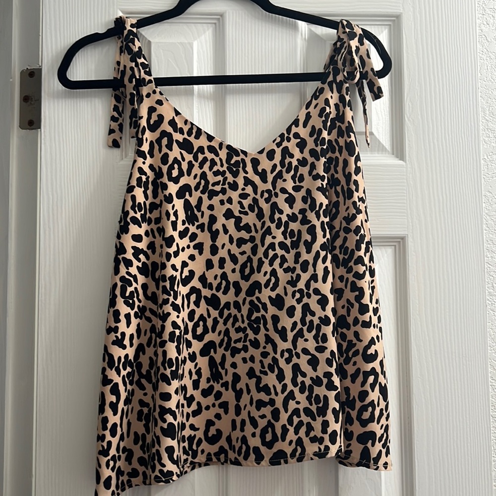 Cheetah print,  size medium blouse